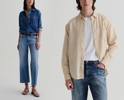 Two models wearing beige and blue button-down shirts over white t-shirts and jeans, standing against a light gray studio background.