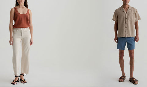 Two people wearing casual clothing on a plain background