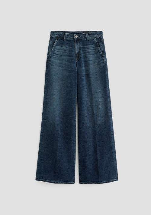 A pair of dark blue wide-leg denim jeans with a faded wash, shown flat against a light gray background.