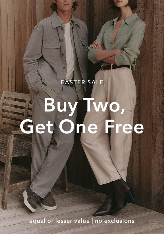 Two people standing in a wooden interior with text overlay for an Easter sale promotion.