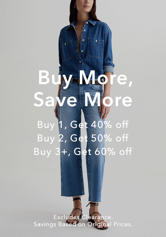 A promotional banner featuring a model on the left in a blue denim shirt and jeans and a model on the right in a beige overshirt over a white tee and jeans, with large white text offering buy-more-save-more discounts.