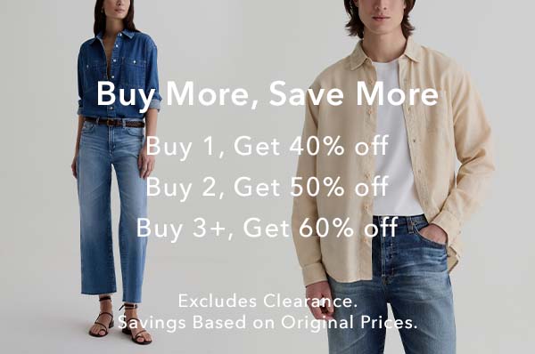 A promotional banner featuring a model on the left in a blue denim shirt and jeans and a model on the right in a beige overshirt over a white tee and jeans, with large white text offering buy-more-save-more discounts.