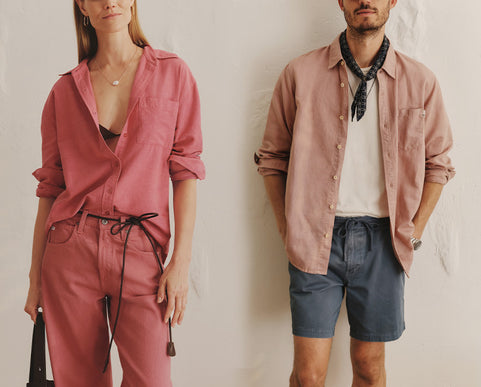 Woman model wearing a pink shirt and jeans. Men model wearing a white t-shirt with a pink button-up and dark grey shorts