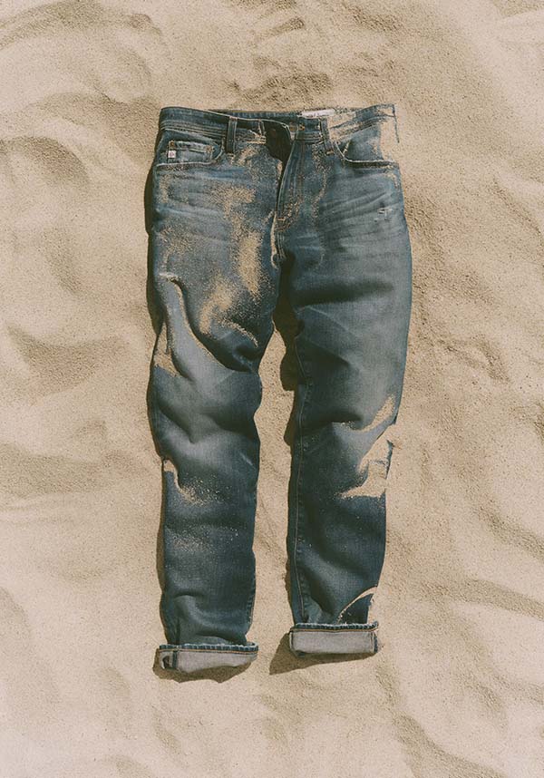 Blue jeans on sand